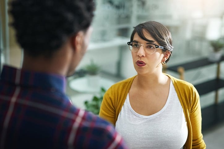 two colleagues arguing in office
