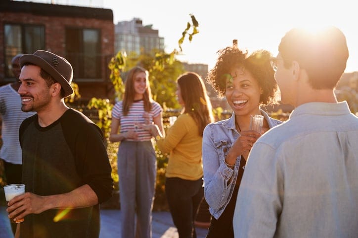 Happy friends at a rooftop party.