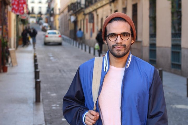 hipster guy in beanie on city street
