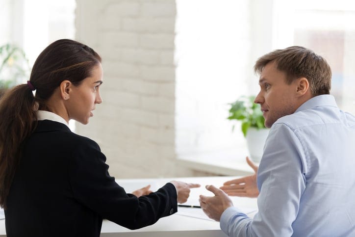 Two colleagues having heated conversation.