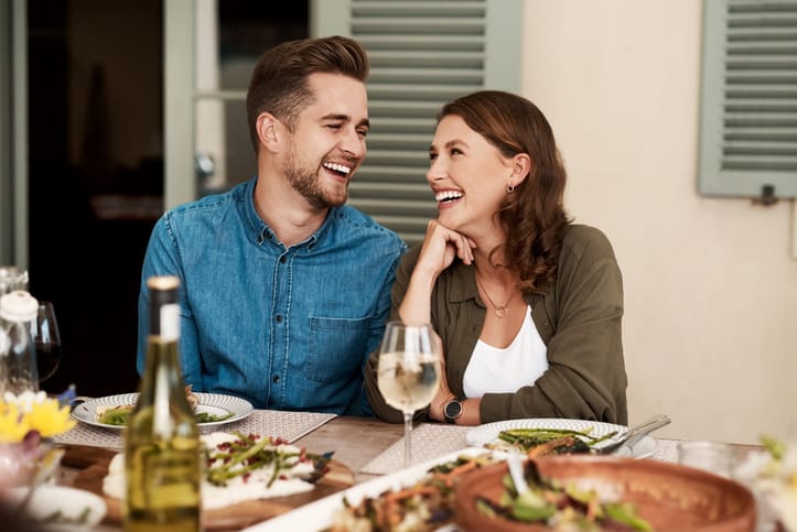 Cropped shot of a couple enjoying a meal together in the yard at home