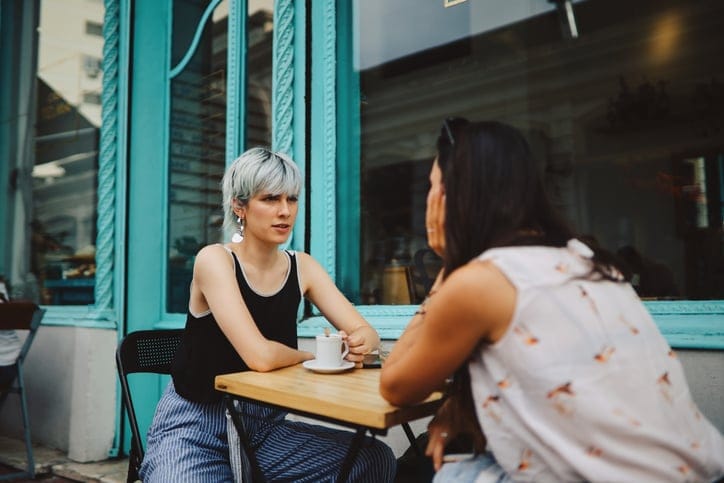 two female friends at outdoor cafe