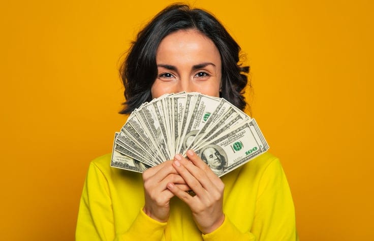 Woman with a large amount of money in her hands.