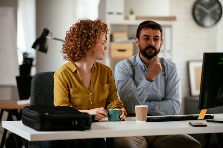 male and female colleague in office