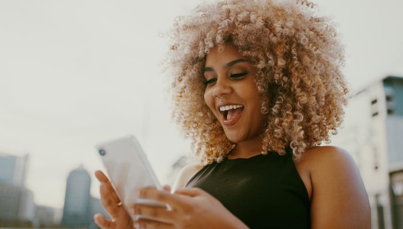 Smiling woman on phone.