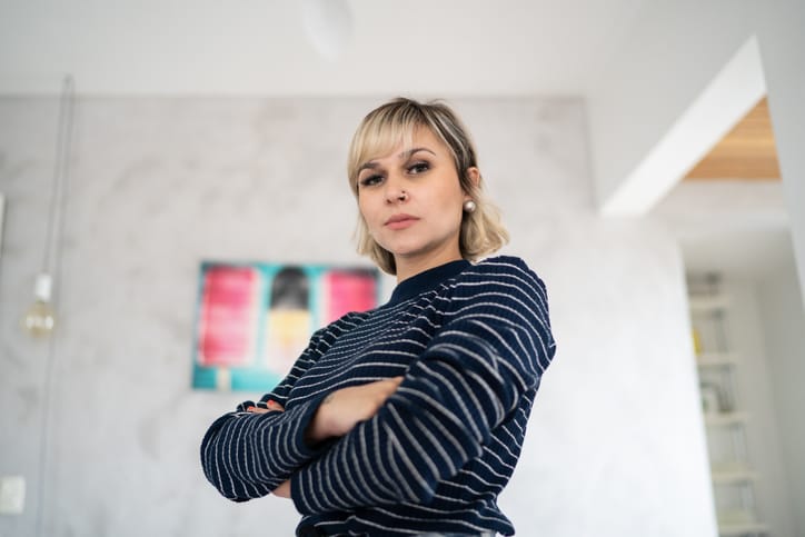 woman with crossed arms at home