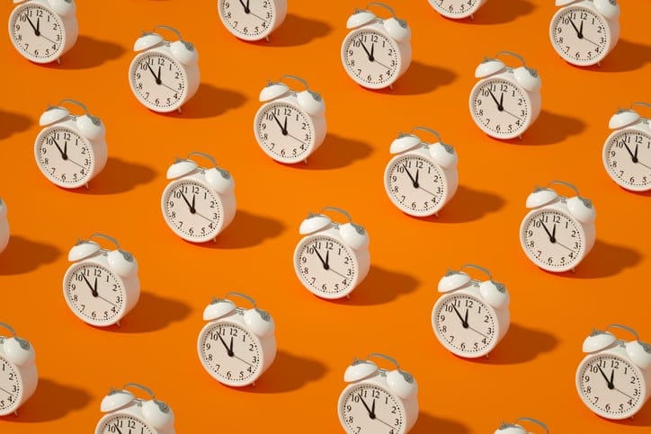 Alarm Clock on Orange Color Background.