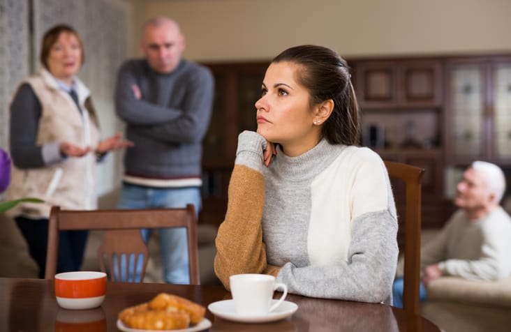 Upset woman after quarrel with parents.