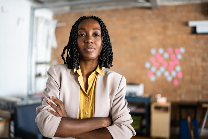 woman with arms crossed at office