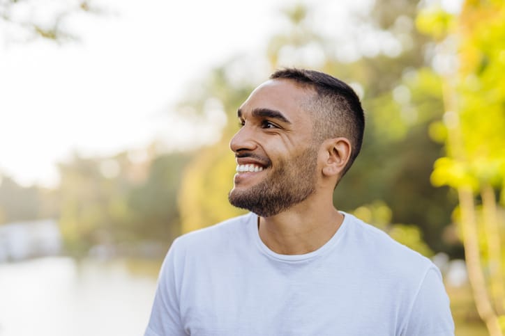 smiling man looking off to side