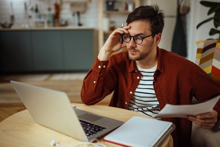 stressed guy looking at computer