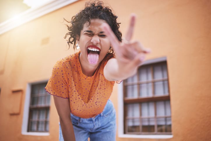 goofy woman giving peace sign