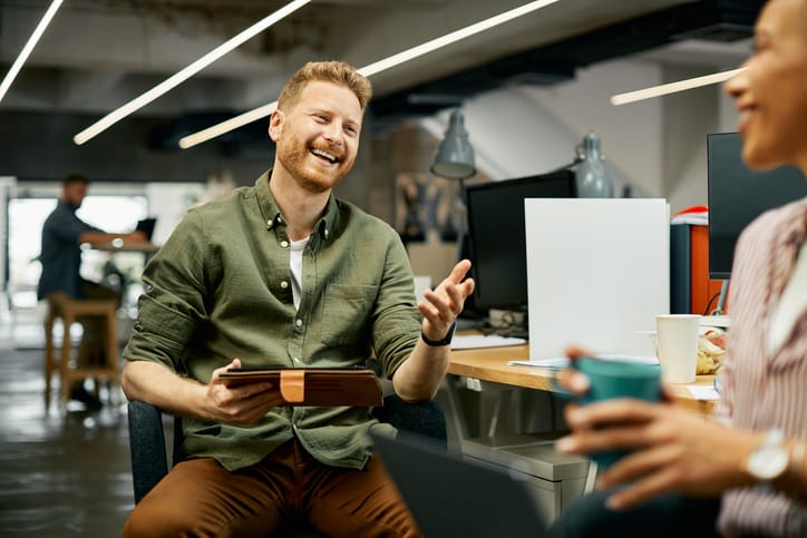 Businessman communicating with coworker in the office.