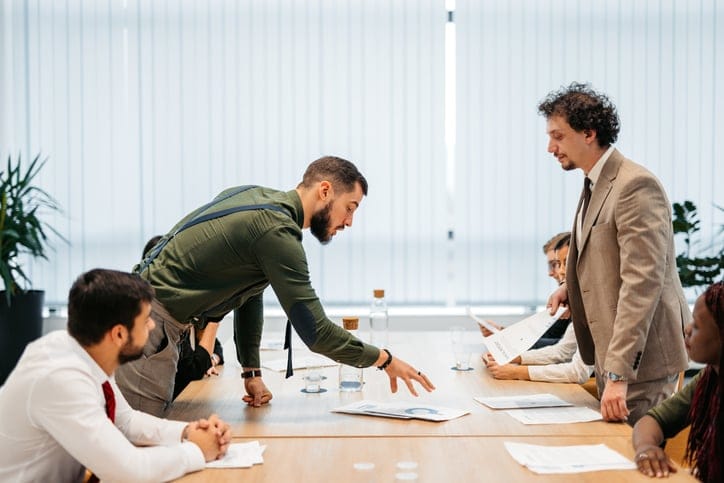 man shouting at business meeting
