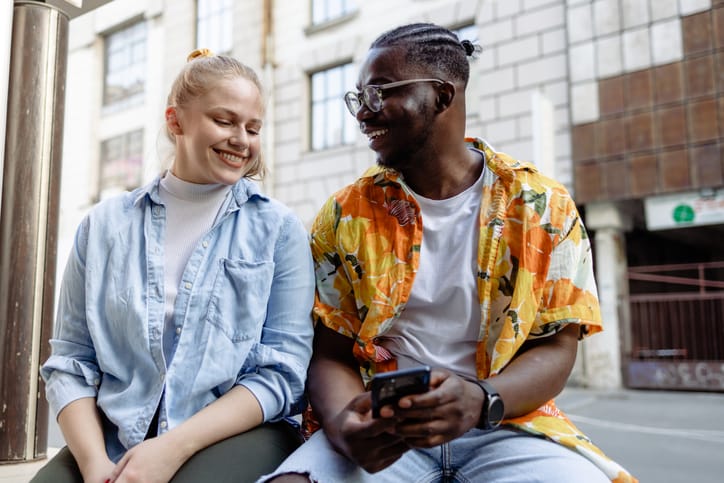 couple sitting outside in city