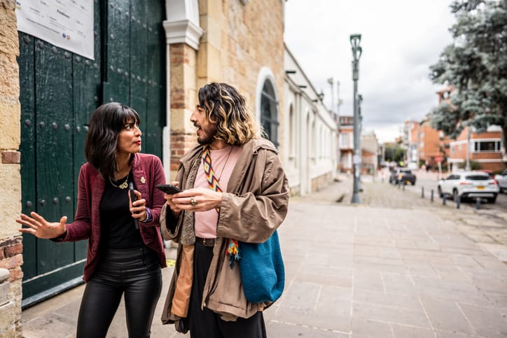 male and female friend walking down the street