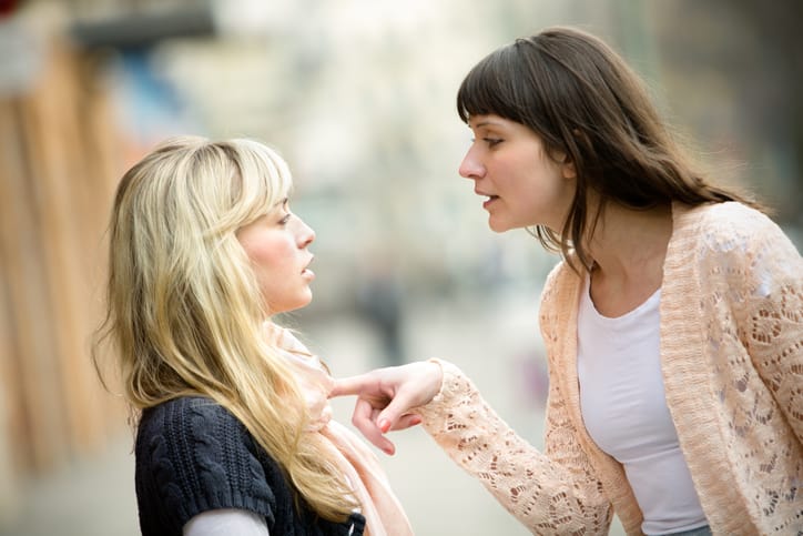 two female friends arguing outside