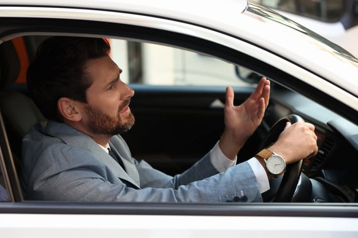 Man stuck in traffic jam.