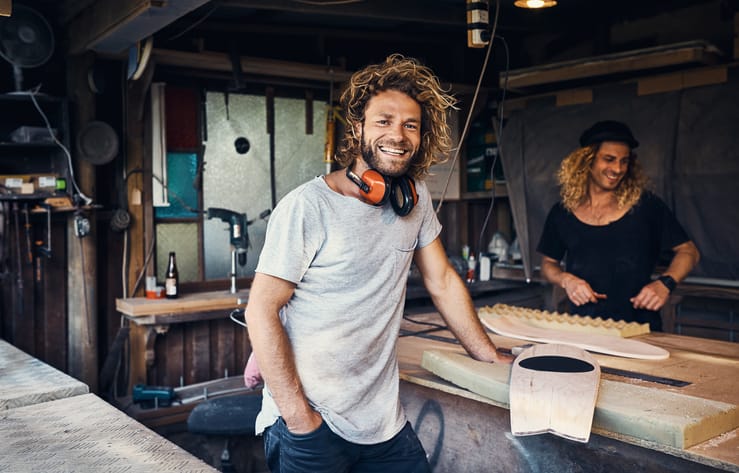 Happy smiling man in workshop