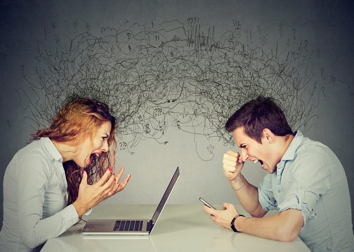 Stressed woman screaming at laptop across angry man shouting at mobile phone.