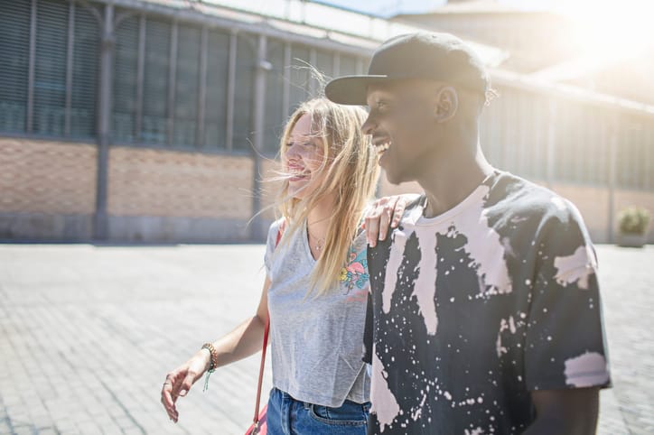 couple walking together in sun
