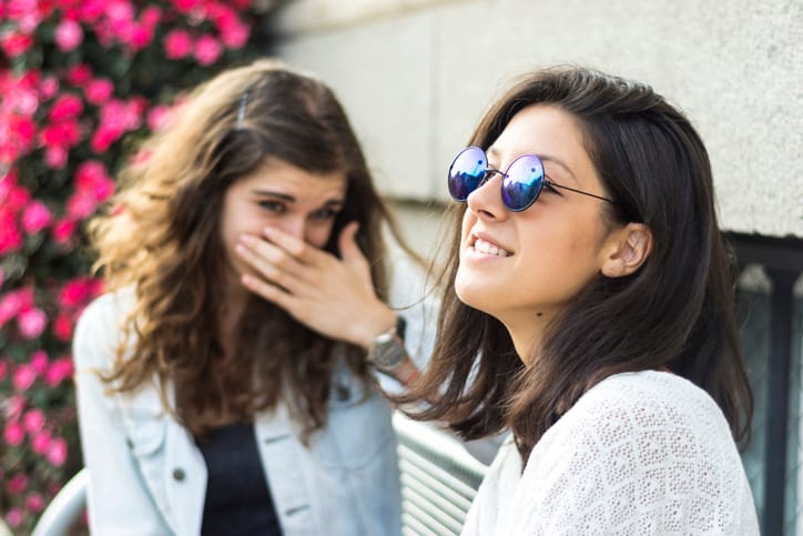 two friends chatting outside