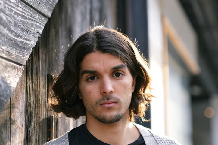Image of a young man looking at the camera.