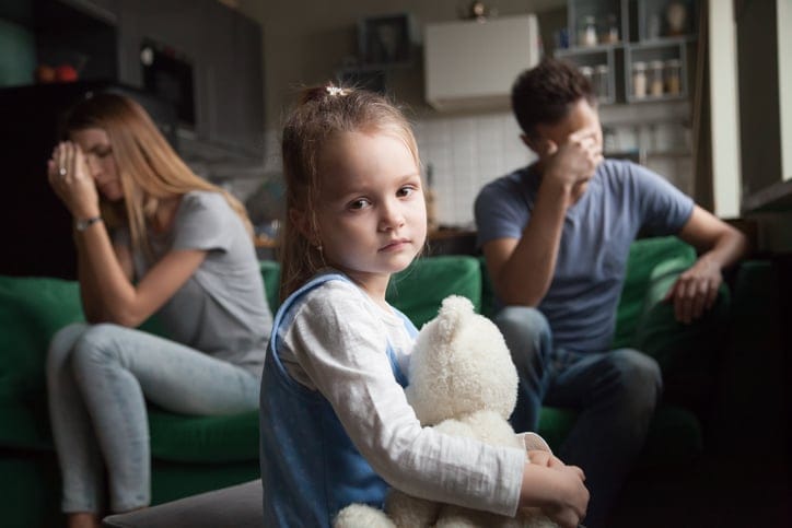 Frustrated girl tired of parents fights.