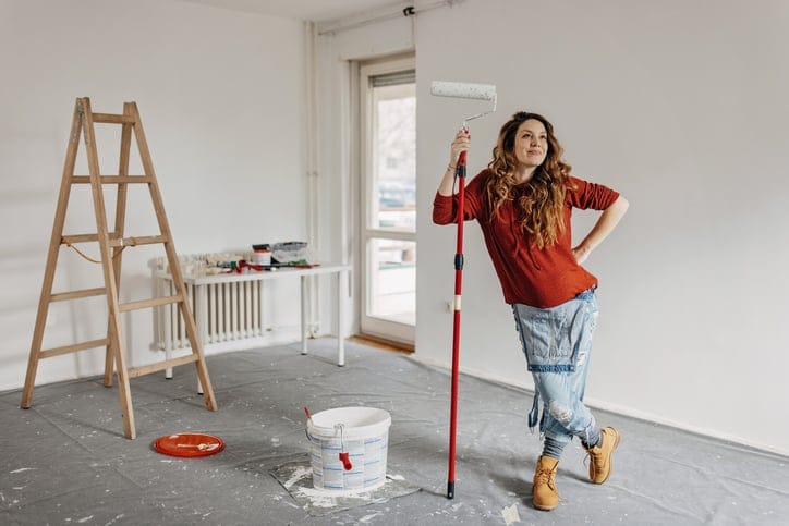woman standing in room with paint
