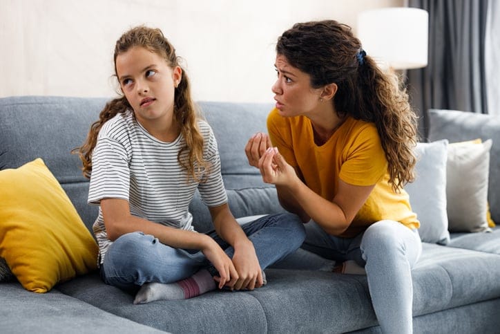 Rude girl ignoring what her single mother is telling her.