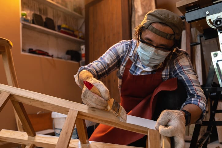 guy painting wood