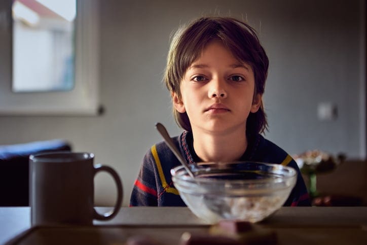 Boy eating cereal.