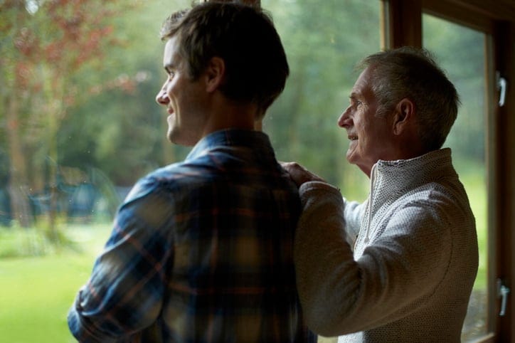 Thoughtful father and son at home.