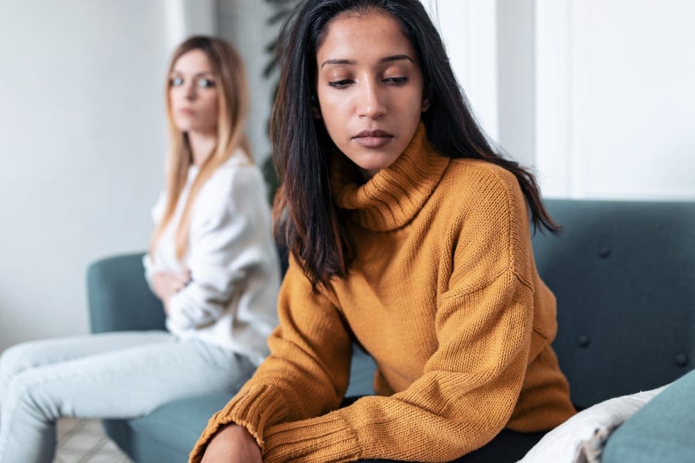 Woman refusing to talk to her friend.