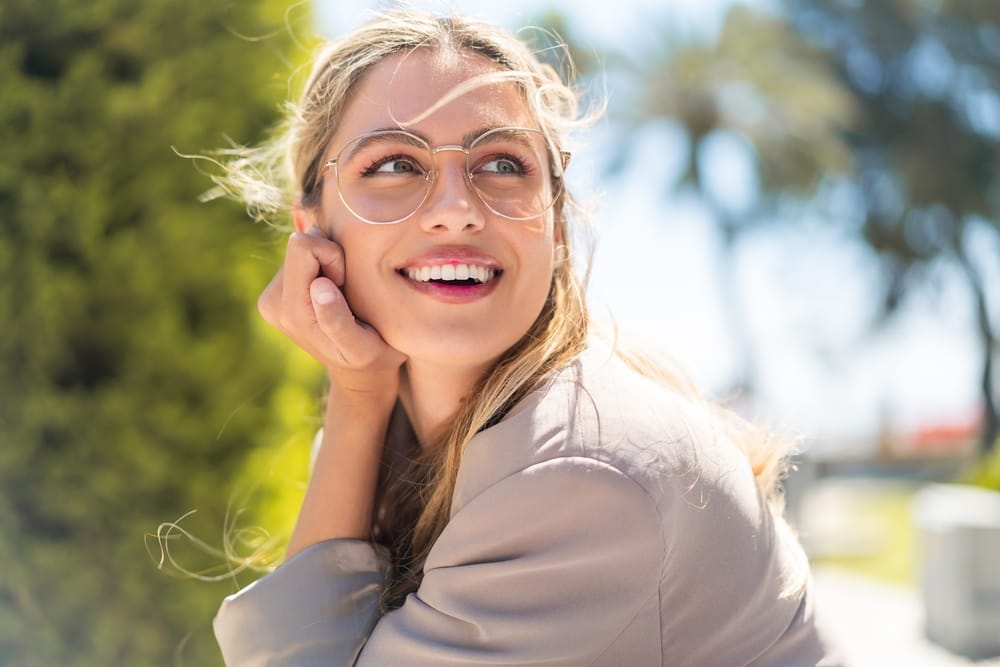 Woman smiling outside.