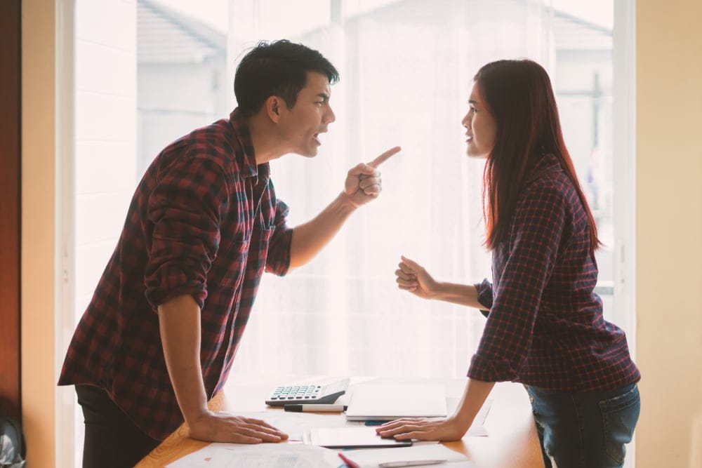 couple arguing over table
