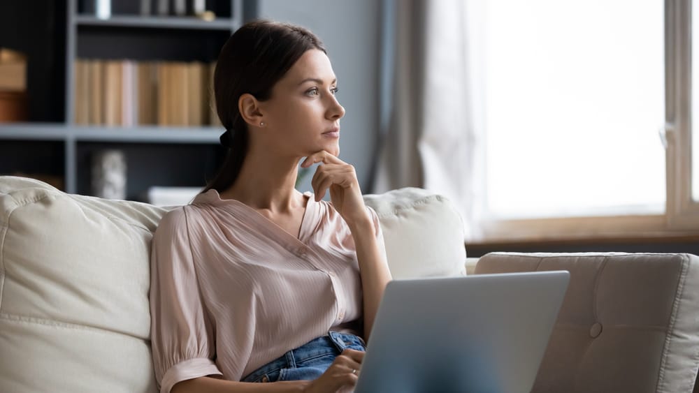 Woman at her desk doing work.