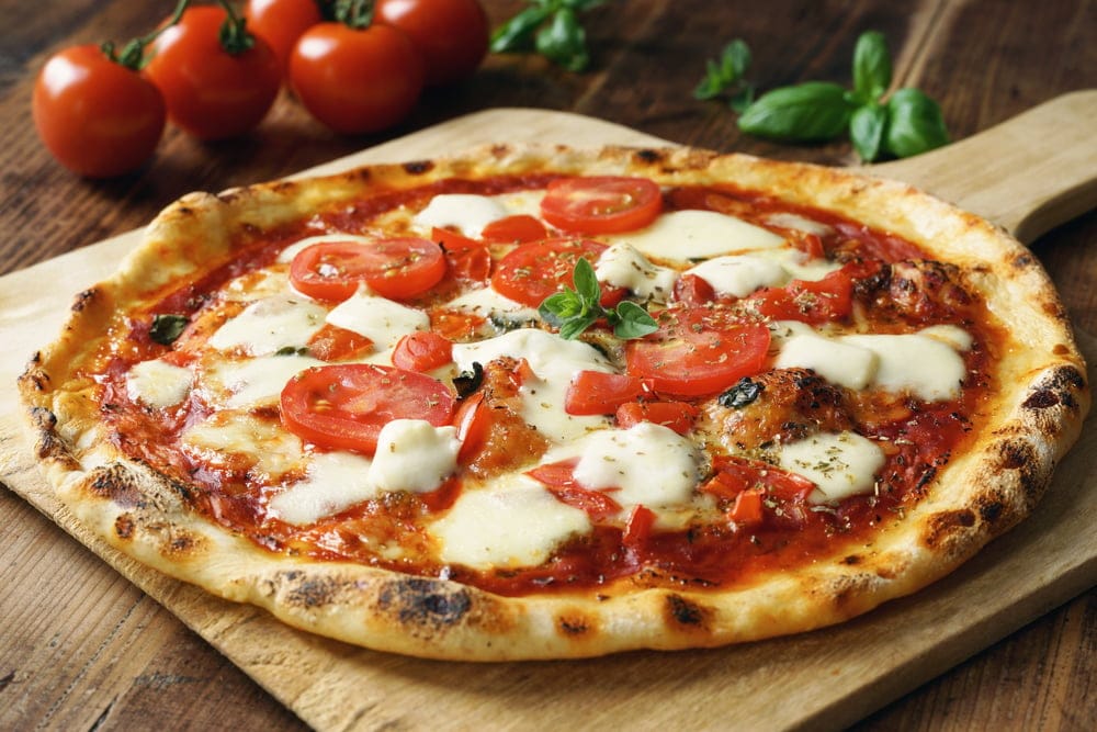 Fresh pizza with tomato.