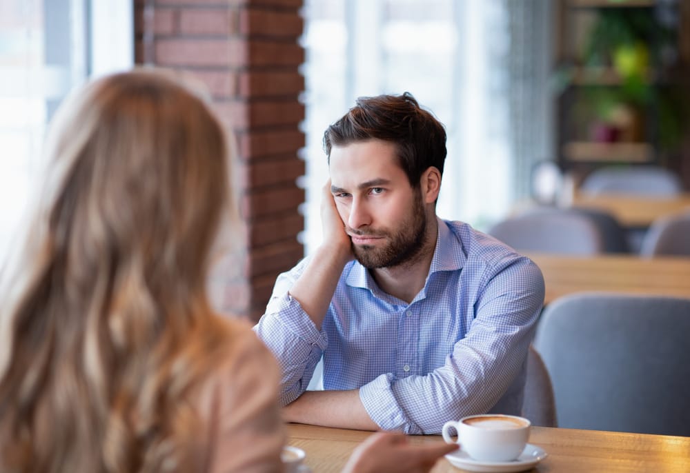 Man bored with woman's company.