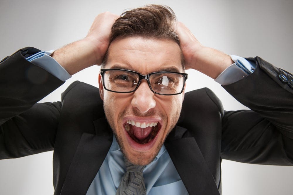 Man pulling on his hair.