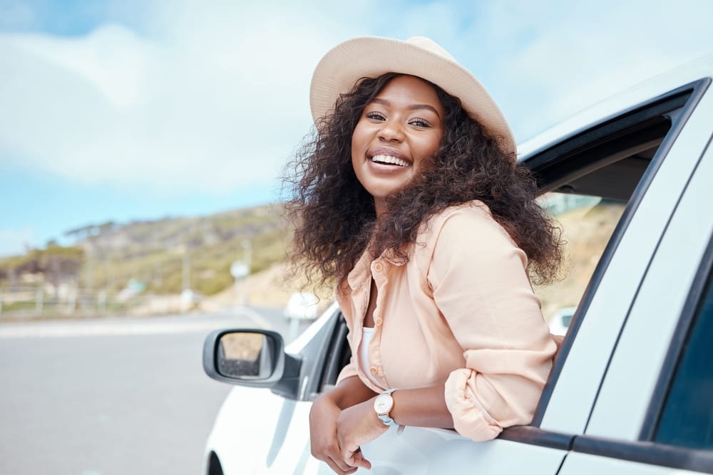 smiling woman riding in car