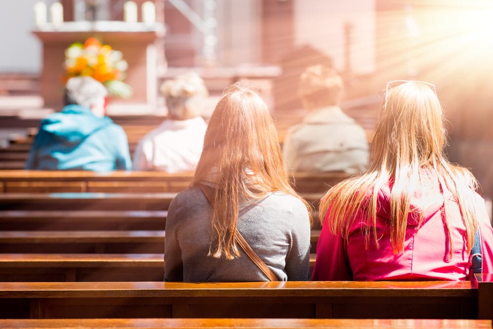 People praying in a church.