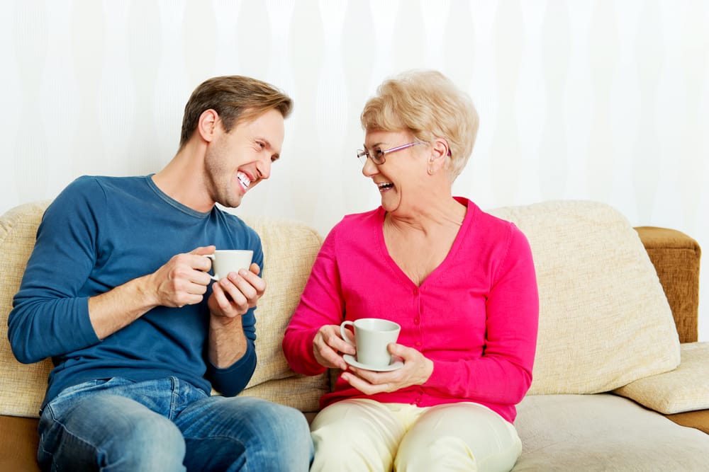 Mother and son sharing coffee.
