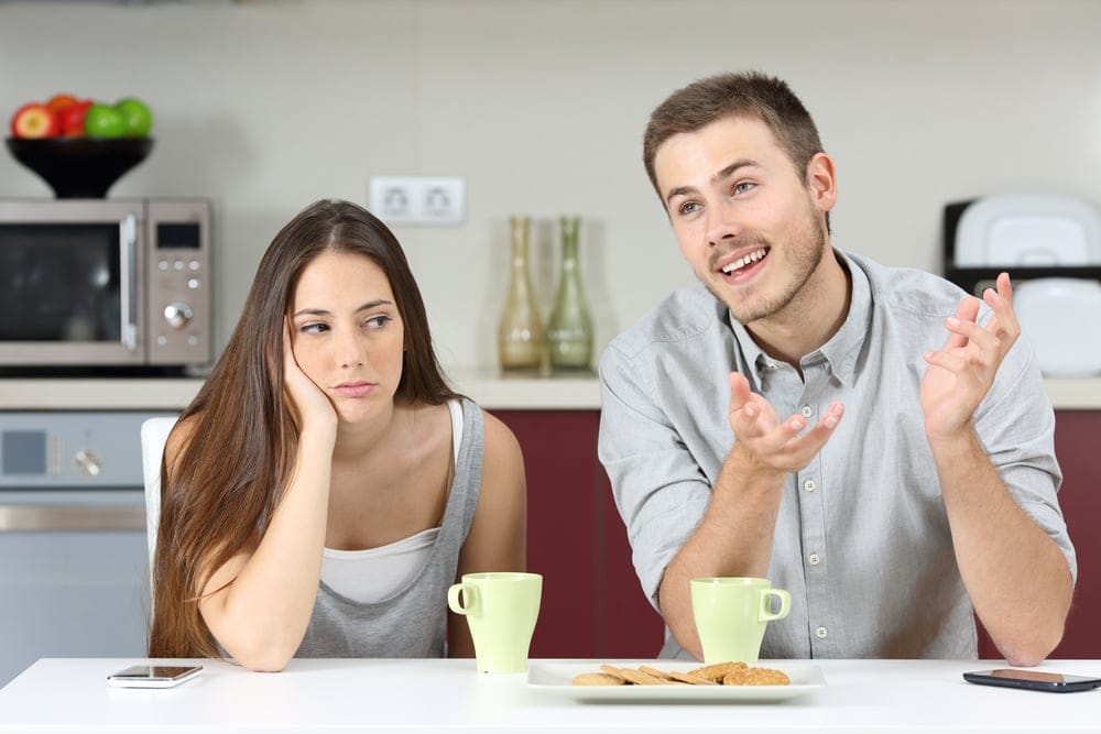 Bored wife listening to her husband.