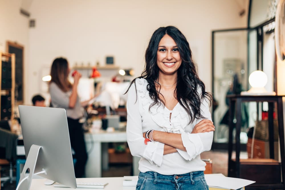 Woman smiling in her office.