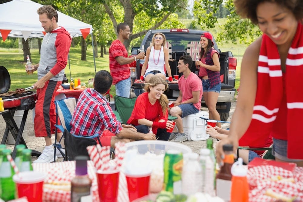 Friends gathering at a tailgate.