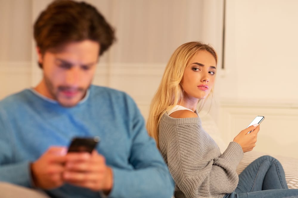 Woman and her boyfriend not speaking to one another.