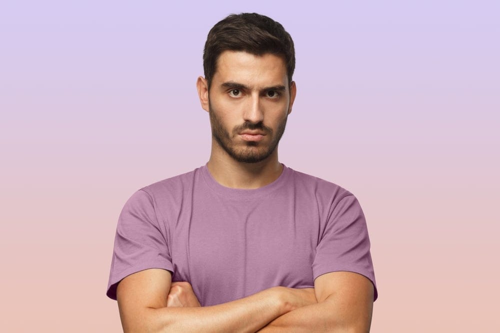 Man standing with his arms crossed.