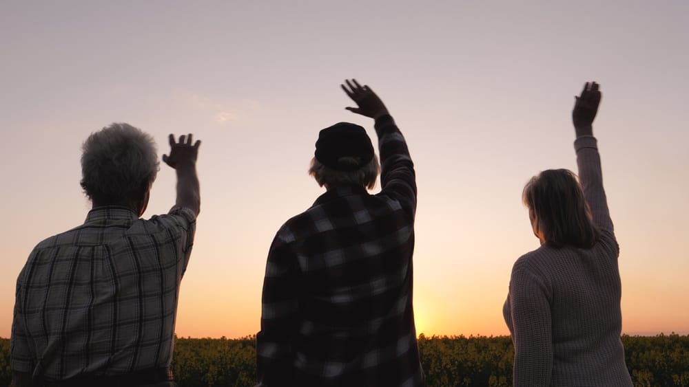 Family waving goodbye.