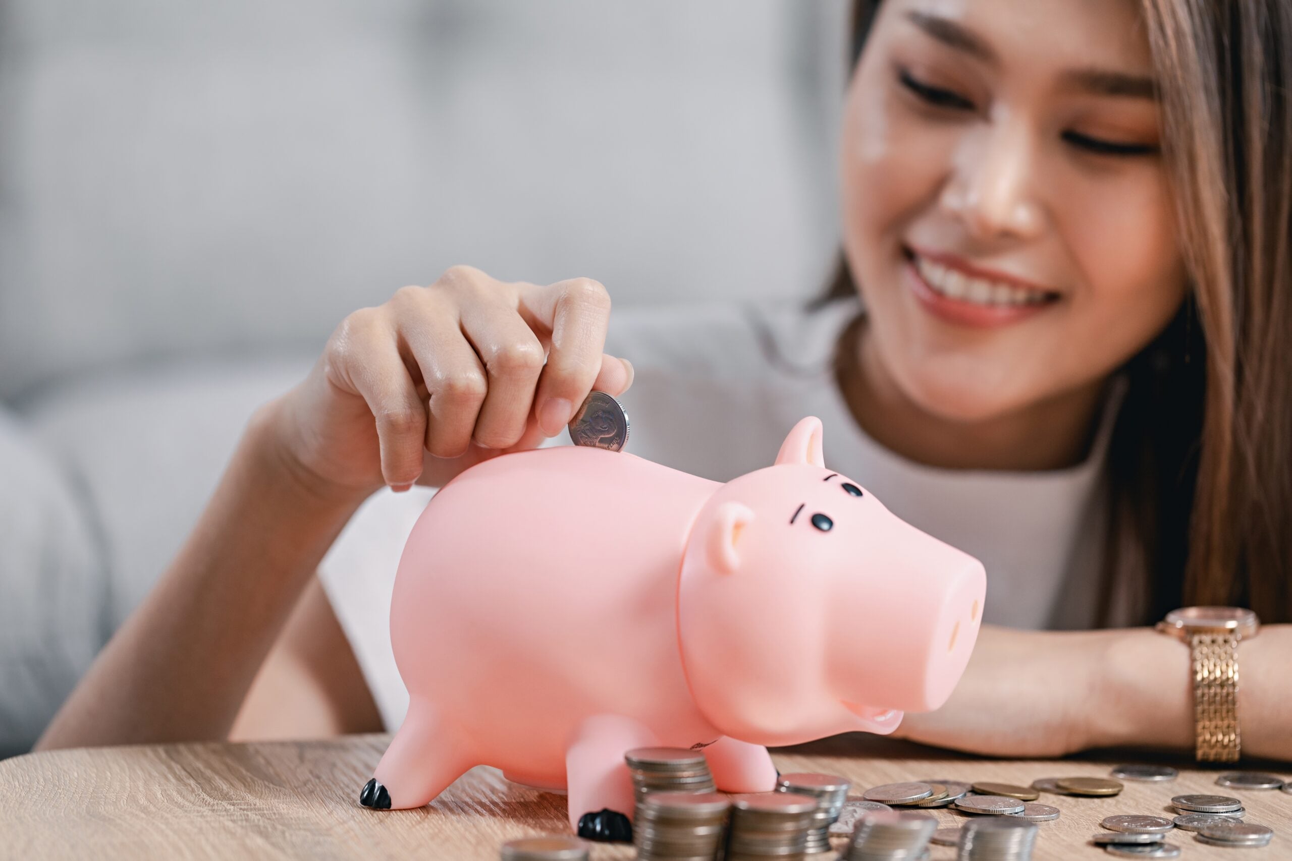 Young woman saving money.